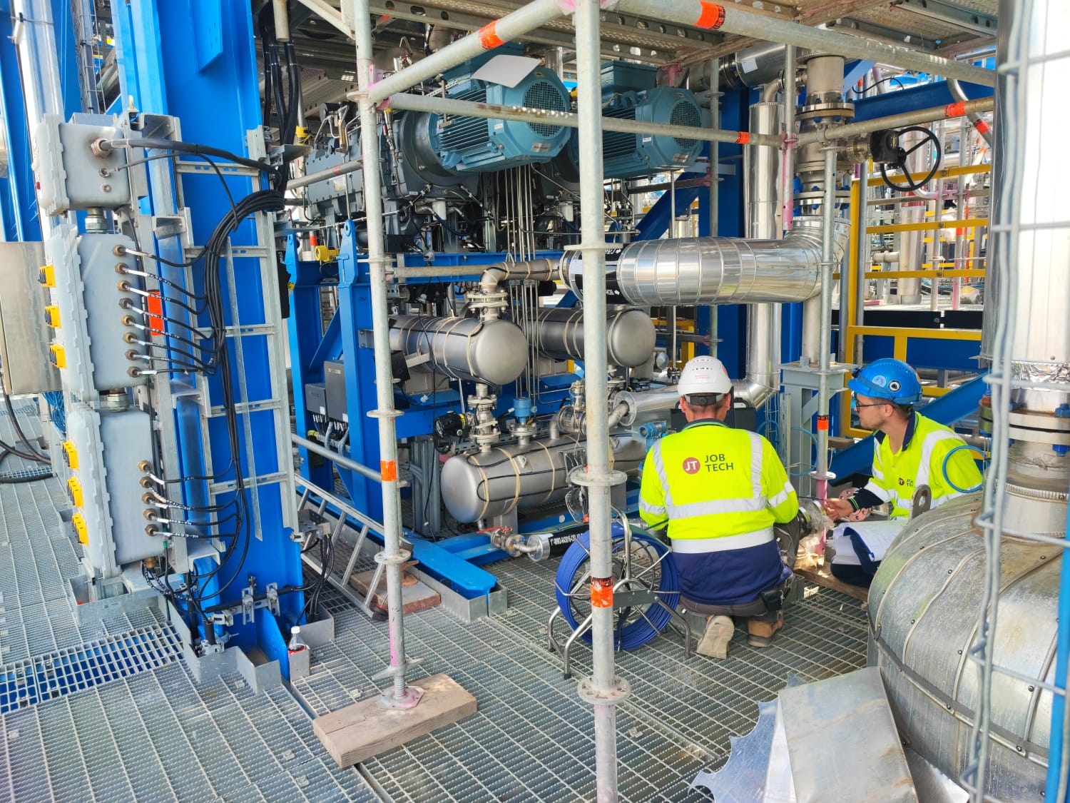 JobTech technicians preparing a temporary connection on a process skid before pre-commissioning cleaning of the piping